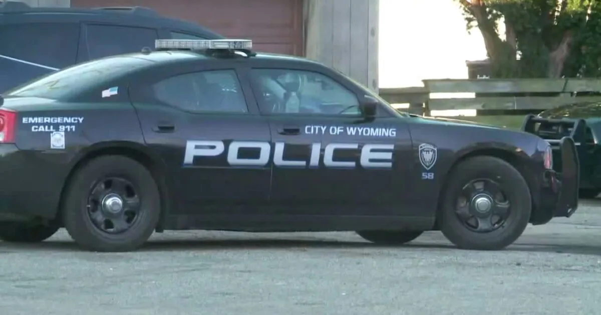 Police investigate a nighttime shooting scene in Wyoming, Michigan